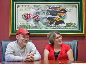 FILE - Powerball lottery winners David, left, and Erica Harrig, of Gretna, Neb., speak during an interview at the law office of their attorney Darren Carlson in Omaha, Neb., on Dec. 13, 2013.