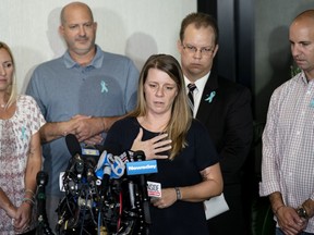 FILE - Nichole Schmidt, mother of Gabby Petito, whose death on a cross-country trip has sparked a manhunt for her boyfriend Brian Laundrie, speaks alongside, from left, Tara Petito, stepmother, Joseph Petito, father, Richard Stafford, family attorney, and Jim Schmidt, stepfather, during a news conference, Tuesday, Sept. 28, 2021, in Bohemia, N.Y. A Florida judge has refused to dismiss a lawsuit, Friday, July 1, 2022, in which the parents of Gabby Petito claim that Brian Laundrie told his parents he had killed her before he returned home alone from their western trip.