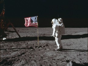 FILE - In this July 20, 1969 photo made available by NASA, astronaut Buzz Aldrin Jr. poses for a photograph beside the U.S. flag on the moon during the Apollo 11 mission. Aldrin and fellow astronaut Neil Armstrong were the first men to walk on the lunar surface with temperatures ranging from 243 degrees above to 279 degrees below zero. Astronaut Michael Collins flew the command module.