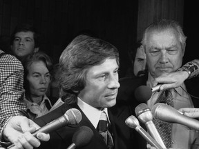 FILE - Movie director Roman Polanski talks with reporters outside the courtroom where he was arraigned on March 30, 1977, in Los Angeles, on rape and sex perversion charges. The case involving Polanski, who fled the United States after he forced himself on a 13-year-old girl during a photo shoot, has spanned 45 years. On Sunday, July 17, 2022, The Associated Press obtained an unsealed court transcript of the former prosecutor in the case testifying that the judge privately told lawyers he would renege on a promise and imprison the renowned director.
