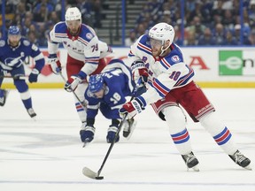 FILE - New York Rangers center Andrew Copp (18) works the puck against the Tampa Bay Lightning during the first period in Game 3 of the NHL hockey Stanley Cup playoffs Eastern Conference finals June 5, 2022, in Tampa, Fla. The Detroit Red Wings signed Copp to a $28.1 million, five-year contract soon after the market opened Wednesday, July 13, and followed up by adding more veteran to a team with a few proven players and some promising prospects.