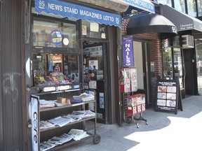 Various local newspapers appear outside a convenience store in the Brooklyn borough of New York on June 30, 2022. The United States continues to see newspapers die at the rate of two per week, according to a report issued Wednesday on the state of local news. The country had 6,377 newspapers at the end of May, down from 8,891 in 2005, the report said.