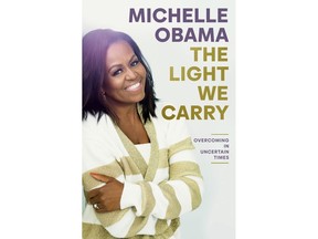 This image released by Random House shows "The Light We Carry" by former first lady and author Michelle Obama. (Random House via AP)