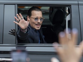 FILE - Actor Johnny Depp waves to supporters as he departs the Fairfax County Courthouse after closing arguments on May 27, 2022 in Fairfax, Va. Heard says she doesn't blame the jury that awarded Johnny Depp more than $10 million after a contentious six-week libel trial in her first post-verdict interview. She told Savannah Guthrie of "Today" in a clip aired Monday that she understood how the jury reached its conclusion and said Depp is a "beloved character and people feel they know him."