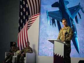 This image provided by the U.S. Air Force shows U.S. Air Force Lt. Gen. Alexus G. Grynkewich, incoming Ninth Air Force (Air Forces Central) commander, delivering a commemorative speech during a change of command ceremony at al-Udeid Air Base, Qatar, Thursday, July 21, 2022. The top U.S. Air Force general in the Middle East has warned that Iran-backed militias could resume attacks in the region against the United States and its allies. Lt. Gen. Grynkewich spoke to journalists before stepping into his new role.