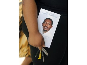A person leaves the funeral of Jayland Walker at the Akron Civic Theatre on Wednesday, July 13, 2022 in Akron, Ohio.