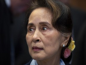 FILE - Myanmar's leader Aung San Suu Kyi waits to address judges of the International Court of Justice in The Hague, Netherlands, Dec. 11, 2019. Judges at the International Court of Justice rule Friday July 22, 2022, on whether a case brought by Gambia alleging that Myanmar is committing genocide against the Rohingya can go ahead. Myanmar argues that the court does not have jurisdiction.