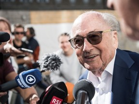 The former president of the World Football Association (Fifa), Joseph Blatter, surrounded by media representatives, gives statements in front of the Swiss Federal Criminal Court in Bellinzona, Switzerland, before the last day of the trail, when the verdict is to be announced, Friday, July 8, 2022. Blatter and the former president of the the European Football Association (Uefa), Michel Platini, stand trial before the Federal Criminal Court from Wednesday, over a suspicious two-million payment. The Federal Prosecutor's Office accuses them of fraud. The defense speaks of a conspiracy.