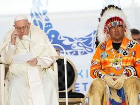 Pope Francis delivers his apology to Indigenous people for the church's role in residential schools as Samson Cree Nation Chief Vernon Saddleback looks on during a ceremony in Maskwacis, Alta., as part of his papal visit across Canada on Monday, July 25, 2022.