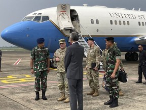 U.S. Army Gen. Mark Milley, center left, chairman of the US Joint Chiefs of Staff, arrives in Jakarta on Sunday, July 24, 2022, for meetings with defense leaders. The Chinese military has become significantly more aggressive and dangerous over the past five years, the top U.S. military officer said during a trip to the Indo-Pacific that included a stop Sunday in Indonesia.