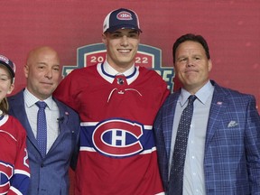 Juraj Slafkovsky poses for photos after being selected as the top pick in the first round of the NHL draft by the Montreal Canadiens in Montreal on Thursday, July 7, 2022.