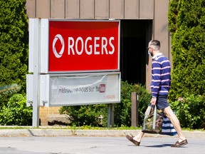 Rogers Communications Inc. will compensate its customers for the massive outage that crippled its network last week by crediting them with the equivalent of five days of service as a first step. Telecommunications company Rogers Communications signage is pictured in Ottawa on Tuesday, July 12, 2022.