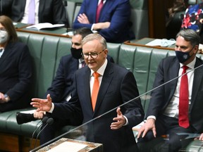 Australian Prime Minister Anthony Albanese speaks in during the opening of the 47th Federal Parliament at Parliament House in Canberra, Tuesday, July 26, 2022. Australia's Parliament sits for the first time since May elections with the new prime minister determined to have a greenhouse gas reduction target enshrined in law.
