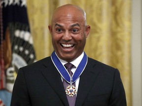 FILE - Former New York Yankees baseball pitcher Mariano Rivera smiles after being presented the Presidential Medal of Freedom by President Donald Trump in the East Room of the White House on Sept. 16, 2019, in Washington. Rivera and ex-Cincinnati Reds shortstop Barry Larkin are leading a push to bring the sport that made them famous to India, Pakistan and the Middle East.