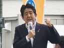 In this image from a video, Japan's former Prime Minister Shinzo Abe makes a campaign speech in Nara, western Japan shortly before he was shot Friday, July 8, 2022. Abe was shot during the speech and was airlifted to a hospital but he was not breathing and his heart had stopped, officials said.