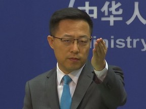 FILE - Chinese Foreign Ministry spokesperson Zhao Lijian gestures during a press conference at the Ministry of Foreign Affairs in Beijing on July 6, 2022. The United States is "the biggest threat to world peace, stability and development," China said Thursday, July 7, continuing its sharp rhetoric in response to U.S. accusations of Chinese spying and threats to the international order.