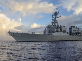 In this photo provided by U.S. Navy, Arleigh Burke-class guided-missile destroyer USS Benfold (DDG 65) conducts routine underway operations in the Philippines Sea on June 24, 2022. The U.S. Navy on Wednesday, July 13, 2022, sailed the destroyer close to China-controlled islands in the South China Sea in what Washington said was a patrol aimed at asserting freedom of navigation through the strategic seaway.