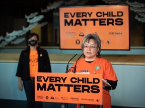 Residential school survivor Phyllis Webstad, founder of Orange Shirt Day, speaks as Tk'emlúps te Secwépemc Kúkpi7 (Chief) Rosanne Casimir listens, on Thursday, Sept. 16, 2021. Manitoba could have a new statutory holiday to mark the National Day for Truth and Reconciliation by September, Premier Heather Stefanson says. The day -- also known as Orange Shirt Day -- was established in honour of the experience of Phyllis Webstad, whose gift of clothing from her grandmother was taken away on Webstad's first day at a residential school.