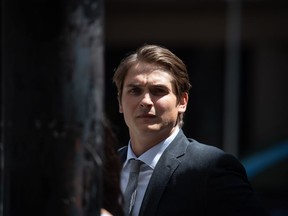 Former Vancouver Canucks NHL hockey player Jake Virtanen leaves B.C. Supreme Court during a lunch break after closing arguments in his sexual assault trial, in Vancouver, on Monday, July 25, 2022.