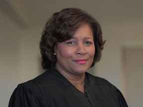 FILE - U.S. District Judge J. Michelle Childs stands in the federal courthouse where she hears cases on Feb. 18, 2022, in Columbia, S.C. The U.S. Senate on Tuesday, July 19, confirmed the nomination of Childs -- recently under consideration for a slot on the U.S. Supreme Court -- to sit on the federal court typically seen as a proving ground for the nation's highest bench. Senators, including a number of Republicans, voted 64 to 34 to approve Childs' nomination to the U.S. Court of Appeals for the District of Columbia Circuit.