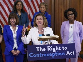Speaker of the House Nancy Pelosi, D-Calif., makes a point during an event with Democratic women House members and advocates for reproductive freedom ahead of the vote on the Right to Contraception Act, at the Capitol in Washington, Wednesday, July 20, 2022. She is flanked by Rep. Kathy Manning, D-N.C., and Rep. Lauren Underwood, D-Ill. Democrats are pushing legislation through the House that would inscribe the right to use contraceptives into law.