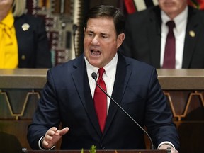 FILE - Arizona Republican Gov. Doug Ducey gives his state of the state address at the Arizona Capitol, Monday, Jan. 10, 2022, in Phoenix. Ducey is part of a burgeoning effort among establishment Republicans to lift up Karrin Taylor Robson against former television news anchor Kari Lake, who is backed by former President Donald Trump.