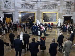 The flag-draped casket bearing the remains of Hershel W. "Woody" Williams is carried by joint service members into the to the U.S. Capitol Rotunda, Thursday, July 14, 2022, in Washington, to lie in honor. Williams, the last remaining Medal of Honor recipient from World War II, died at age 98.
