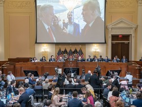 A image of former President Donald Trump talking to his Chief of Staff Mark Meadows is seen as Cassidy Hutchinson, former aide to Trump White House chief of staff Mark Meadows, testifies as the House select committee investigating the Jan. 6 attack on the U.S. Capitol holds a hearing at the Capitol in Washington, Tuesday, June 28, 2022.