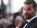 FILE - Ricky Martin poses for photographers upon arrival at the premiere of the film 'Elvis' at the 75th international film festival, Cannes, southern France, May 25, 2022. A judge has issued a restraining order against Martin, police said Saturday, July 2, 2022.