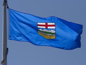 Alberta's provincial flag flies on a flag pole in Ottawa, Monday July 6, 2020. THE CANADIAN PRESS/Adrian Wyld ORG XMIT: 20200707ajwAB107