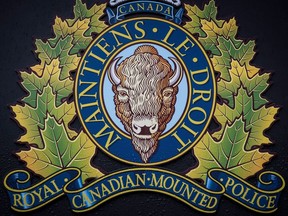 The RCMP logo is seen outside Royal Canadian Mounted Police "E" Division Headquarters, in Surrey, B.C., on Friday April 13, 2018. The RCMP say a man has been shopt dead after officers received reports of a woman trying to escape a vehicle travelling along the Trans Canada Highway near Kamloops, B.C.