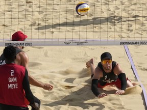 Canada's Sam Schachter, right, in action during Men's Preliminary Pool A beach volleyball match between Canada and Gambia at Smithfield at the Commonwealth Games in Birmingham, England, Thursday, Aug. 4, 2022.