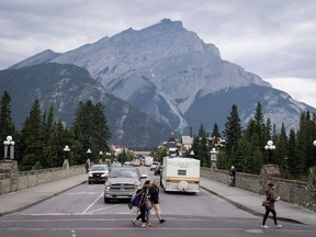 Smoke haze from forest fires burning in Alberta and British Columbia hangs over Banff, Alta., in Banff National Park, Friday, July 21, 2017. A fire ban is now in place in three mountain parks in Alberta and British Columbia due to a high risk of wildfires in the area. A notice posted on the Banff National Park website says the ban, which also includes Yoho and Kootenay national parks in B.C., was issued to ensure the safety of residents and visitors.