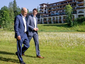 Prime Minister Justin Trudeau and Olaf Scholz, Chancellor of Germany
take a stroll at the G7 Summit in Schloss Elmau on Monday, June 27, 2022.