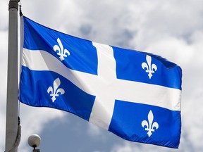 Quebec's provincial flag flies on a flagpole in Ottawa, Friday, July 3, 2020.