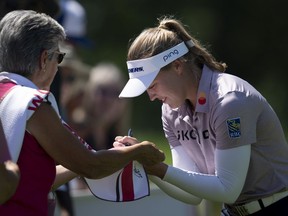 Canadian Brooke Henderson signs autographs for fans at the CP Women's Open Pro-Am tournament, Wednesday, August 24, 2022 in Ottawa. The golf phenom may be what Ottawa's tourism industry needs to revitalize its flagging numbers.
