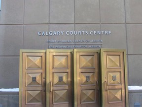 The sign at the Calgary Courts Centre is shown on Jan. 5, 2018. A Calgary man who deliberately drove over his wife with a van during an argument and left her to die alone on a snow-covered street will not be eligible parole until he has served 16 years of his life sentence.THE CANADIAN PRESS/Bill Graveland