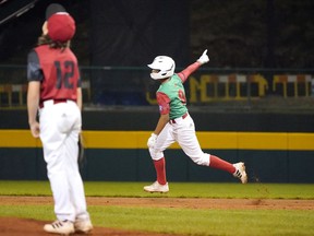 Mexico's Miguel Padila (9) rounds the bases on his two run home run off of Canada pitcher Dylan Larter (12) during the third inning of a baseball game at the Little League World Series tournament in South Williamsport, Pa., Monday, Aug. 22, 2022.