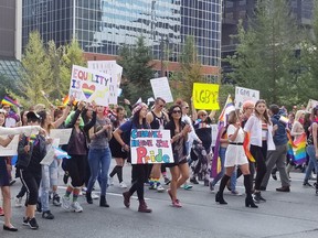 People take part in a recent Calgary Pride parade. Calgary Pride says this year's parade marshals will be LGBTQ refugees who now call the city home.