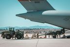 An M777 howitzer is loaded onto a U.S. Air Force Globemaster in June, destined for the Ukraine front lines. Canada has tacked on a few of its own M777s onto U.S. shipments, and arranged a deal to supply 20,000 shells for the guns. 