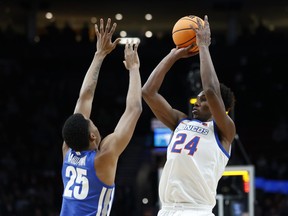 Boise State forward Abu Kigab (24) shoots over Memphis guard Jayden Hardaway (25) during the first half of a first round NCAA college basketball tournament game, Thursday, March 17, 2022, in Portland, Ore. Trae Bell-Haynes, Kigab and Jean-Victor Mukama have been added to Canada's roster for the team's FIBA World Cup qualifying game against Panama on Monday.THE CANADIAN PRESS/AP/Craig Mitchelldyer