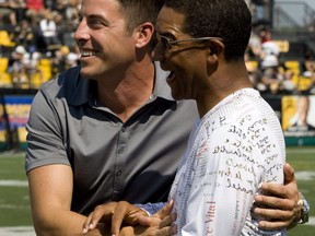 Toronto Argonauts quarterback Damon Allen greets retiring Hamilton Tiger-Cats player Mike Morreale during a half time ceremony in Hamilton, Ont., Monday, Sept. 3, 2007. Morreale says people thought he was crazy when he became commissioner and CEO of a fledgling Canadian Elite Basketball League four years ago.