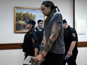 U.S. Women's National Basketball Association (NBA) basketball player Brittney Griner leaves the courtroom after the court's verdict in Khimki outside Moscow, on August 4, 2022.