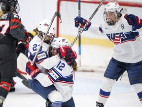 Kelly Pannek of USA celebrates with Hannah Bilka and Hilary Knight after scoring the 2-2 during The IIHF World Championship Woman's ice hockey match between Canada and USA in Herning, Denmark, Tuesday, Aug 30, 2022.