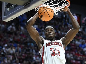 Arizona center Christian Koloko (35) dunks against Wright State during the second half of a first-round NCAA college basketball tournament game, Friday, March 18, 2022, in San Diego. The Toronto Raptors have signed Koloko, their only selection in the 2022 NBA draft.