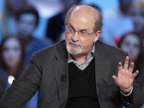 In this file photo taken on November 16, 2012, British author Salman Rushdie takes part in the TV show "Le grand journal" on a set of French TV Canal+ in Paris.(Photo by Kenzo TRIBOUILLARD / AFP)