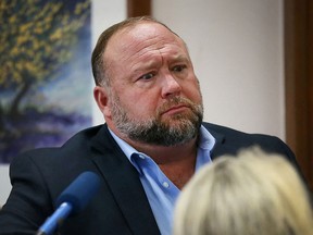 Alex Jones is cross examined by a lawyer for Sandy Hook parents Neil Heslin and Scarlett Lewis in an Austin, Texas, court on August 3, 2022.