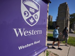 Students walk across campus at Western University in London, Ont., Saturday, Sept. 19, 2020. THE CANADIAN PRESS/Geoff Robins