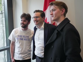 Federal Conservative leadership candidate Pierre Poilievre, centre, poses for photographs with supporters during a meet and greet at the University of British Columbia in Vancouver on Thursday, April 7, 2022. THE CANADIAN PRESS/Darryl Dyck