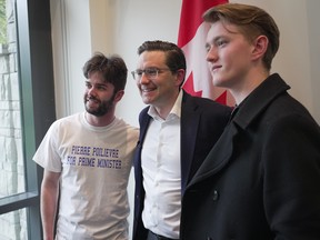 Conservative leadership candidate Pierre Poilievre poses for photographs with supporters during an April meet and greet at the University of British Columbia.